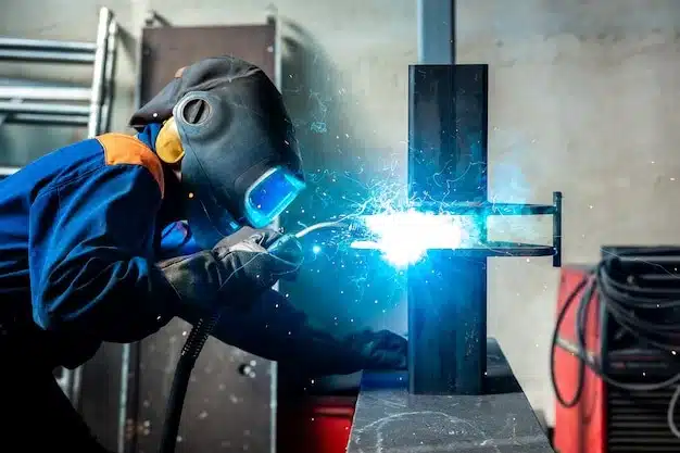 A welder is using a high power welding machine