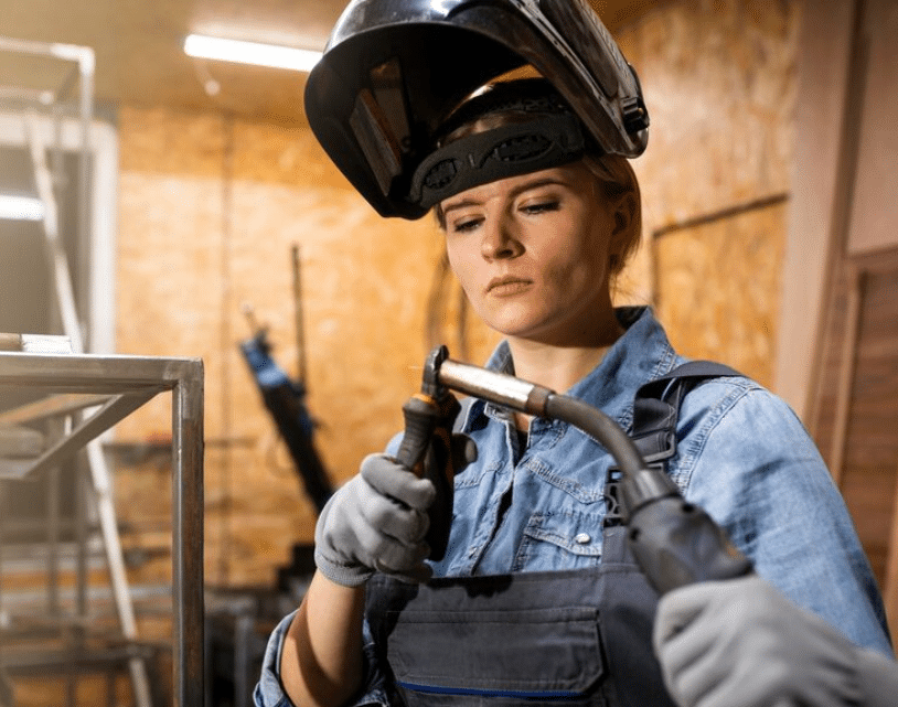 Automotive welder wearing protective equipment to ensure welding safety3